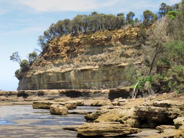 Cliffs, sea, ocean, and weathered sandstone clipart