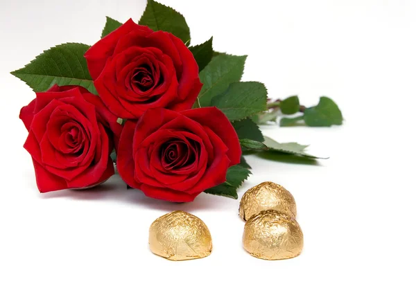 Candies and roses — Stock Photo, Image