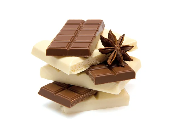 Slices of black and white chocolate — Stock Photo, Image