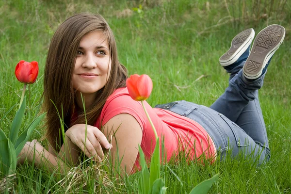 Young girl and tulips — Stock Photo, Image