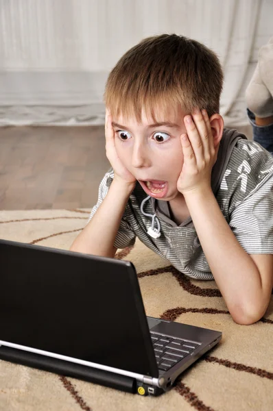 Litle boy with laptop — Stock Photo, Image