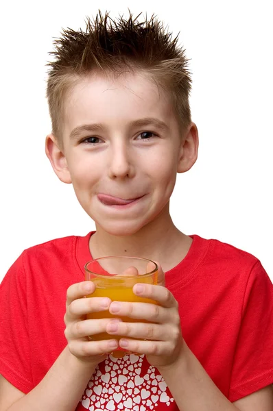 Хлопчик зі склянкою соку — стокове фото