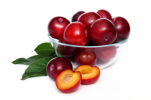 Plums in a glass bowl — Stock Photo, Image