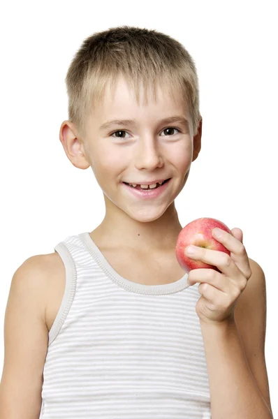 Хлопчик з червоним яблуком — стокове фото