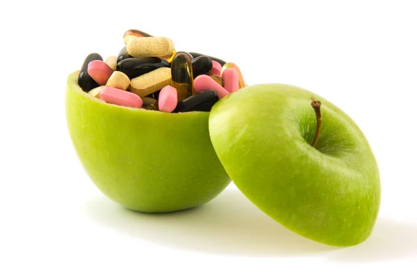 Apple with pills — Stock Photo, Image