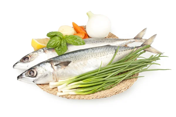 Fresh sardines on a plate with vegetables — Stock Photo, Image