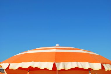 Orange beach umbrella clipart