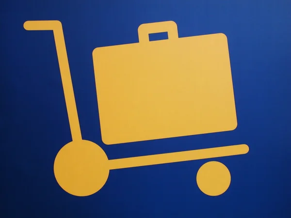 stock image Luggage cart airport sign