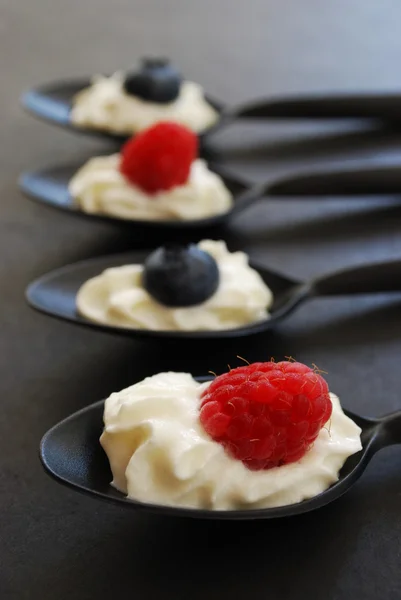 Stock image Blueberries and raspberries with whipped cream