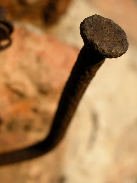 Rusty nail in the wall — Stock Photo, Image