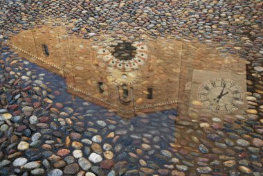 Reflection of a church in a puddle clipart