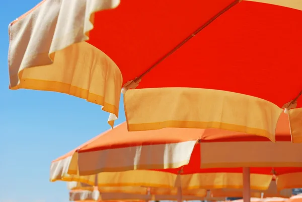 Orange beach umbrella — Stock Photo, Image