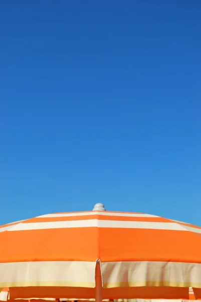 stock image Orange beach umbrella