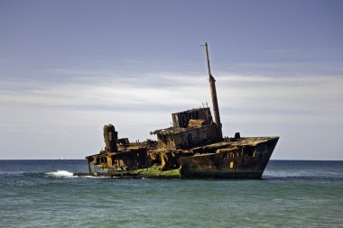 Ship wreck on a beach clipart