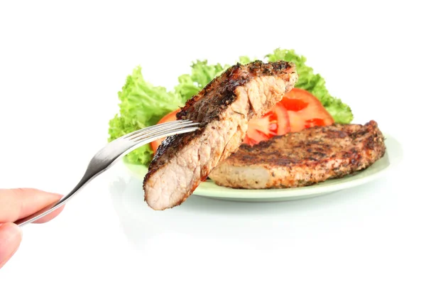 Стейк из жареного мяса на вилке — стоковое фото