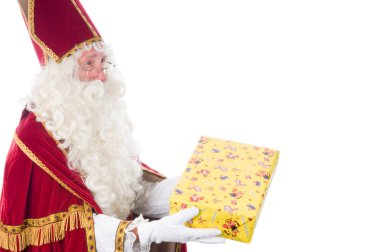 Sinterklaas is giving a present clipart