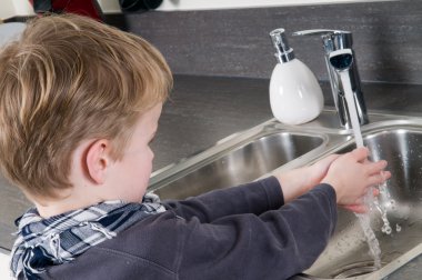 Child washing his hands clipart