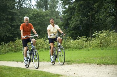 Biking Senior Couple clipart