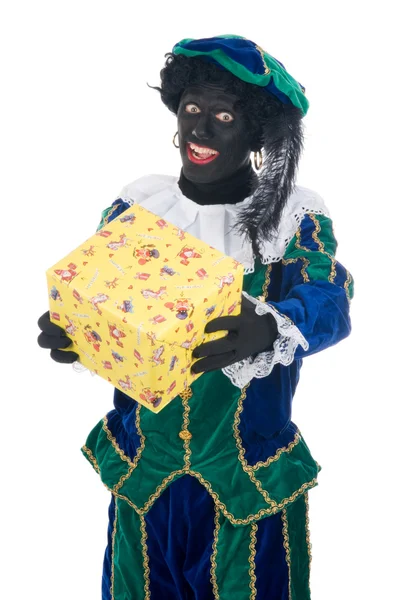 Zwarte Piet giving a present — Stock Photo, Image