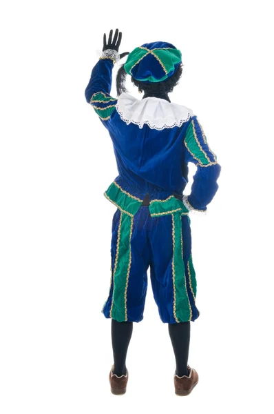 Zwarte Piet fra bagsiden, vinker hans hånd . - Stock-foto