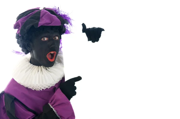 Zwarte Piet, дивлячись на білі дошки — стокове фото