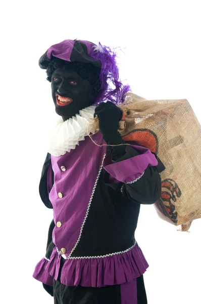 Zwarte Piet com um saco cheio de presentes — Fotografia de Stock