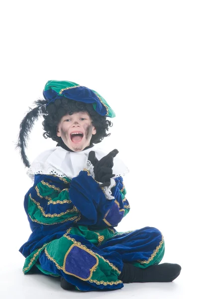 Barn leger Zwarte Piet eller Black Pete - Stock-foto