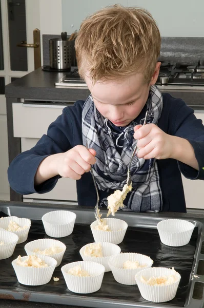 Kid Filling Cakecups With Dough — Stock Photo, Image