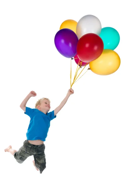 Chico volando detrás de globos —  Fotos de Stock