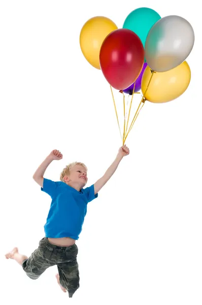 Boy Flying Behind Balloons — Stok fotoğraf