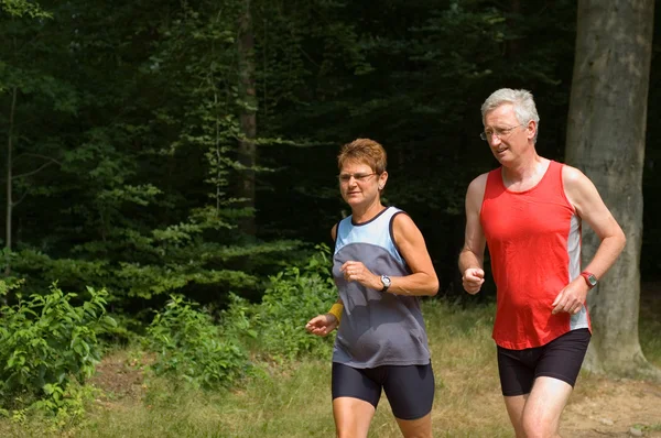 Senior couple running — Stock Photo, Image