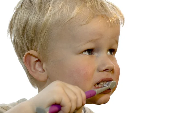 Kid brushing teeth Royalty Free Stock Photos