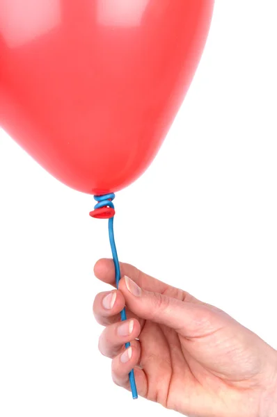 Mão de mulher segurando um balão — Fotografia de Stock