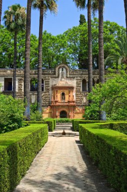 English gardens of the Alcazar Palace clipart