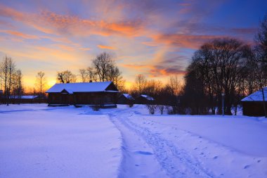 Sunset in countryside at winter clipart