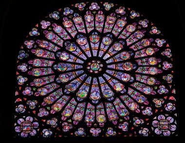 Stained glass window in Notre dame clipart
