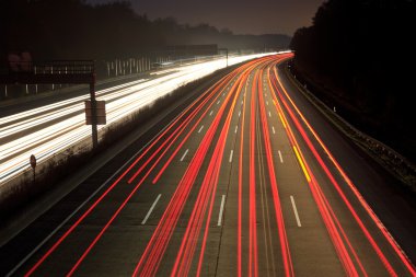 Night time traffic on highway clipart