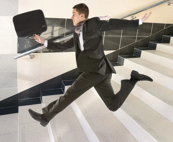 stock image Businessman running on stair