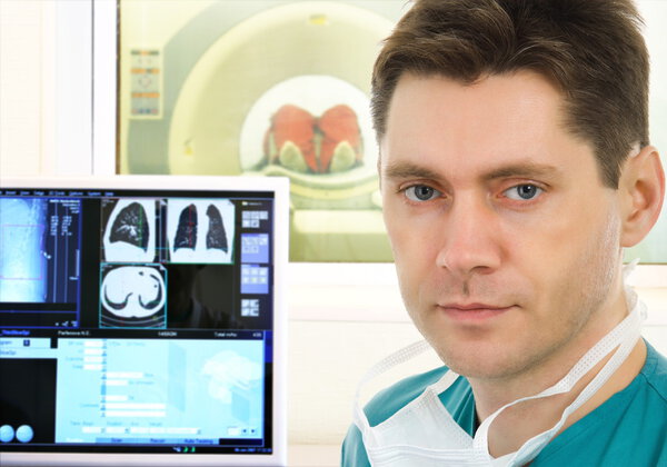 Doctor and tomographic scanner in hospital