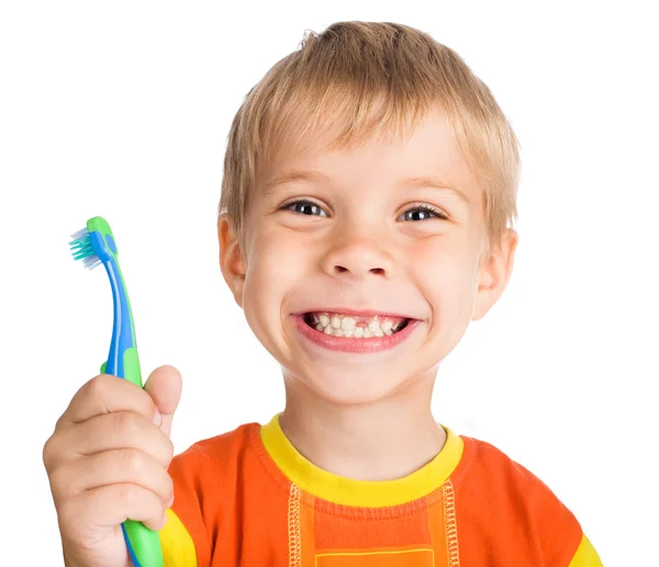 Мальчик без одного зуба с зубной щеткой — стоковое фото