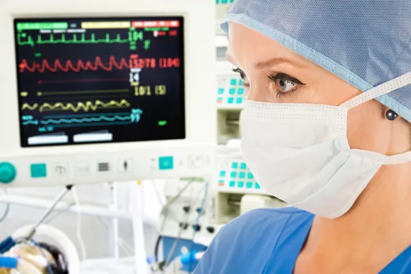 Doctor with surveillance monitor — Stock Photo, Image
