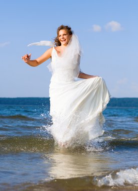 Running laughing bride