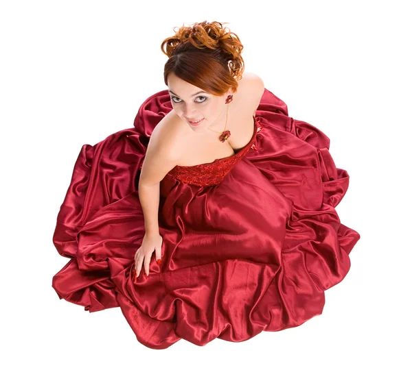 Femme assise en robe rouge — Photo