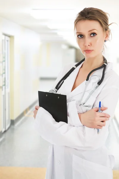 Young doctor in clinic's corridor — Stock Photo, Image