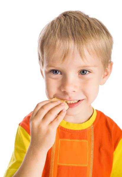 Chlapec stravovací cookie — Stock fotografie