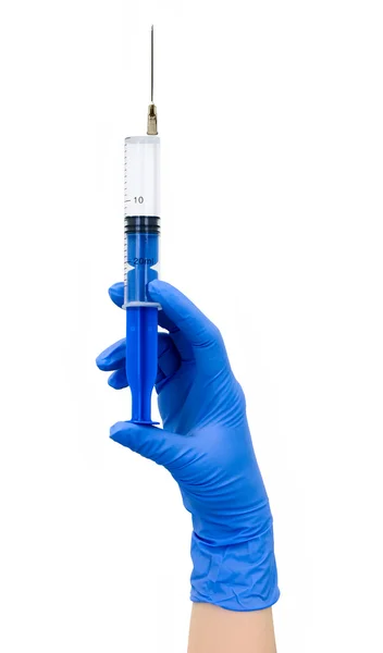 Mão com seringa azul — Fotografia de Stock