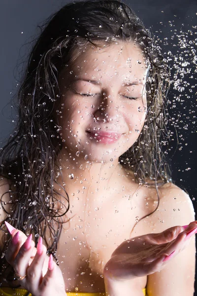 stock image Young woman enjoy in water splashes