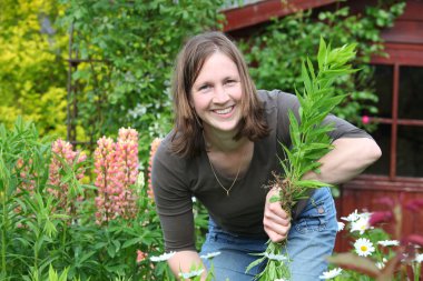 Woman works in the garden clipart