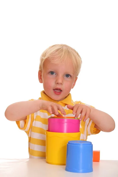 Child plays with stacking toy — Stock Photo, Image