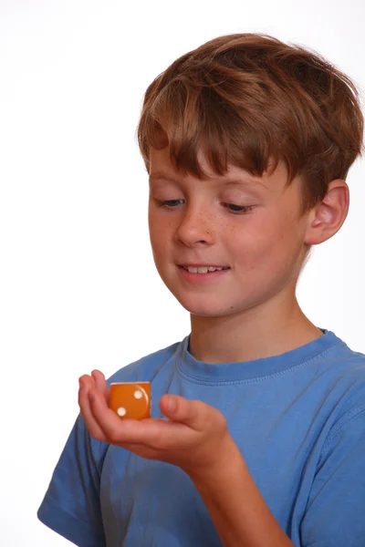 Boy rolls the dice — Stock Photo, Image